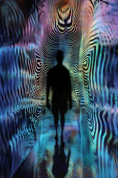 Photo a man is standing in a dark tunnel with a figure in the middle