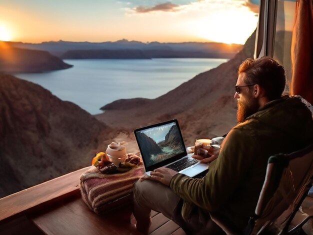 Photo a man is working on a laptop and eating breakfast