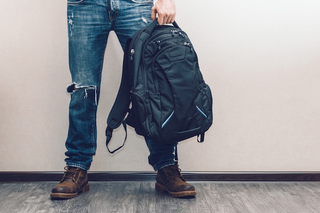 Man in jeans with backpack