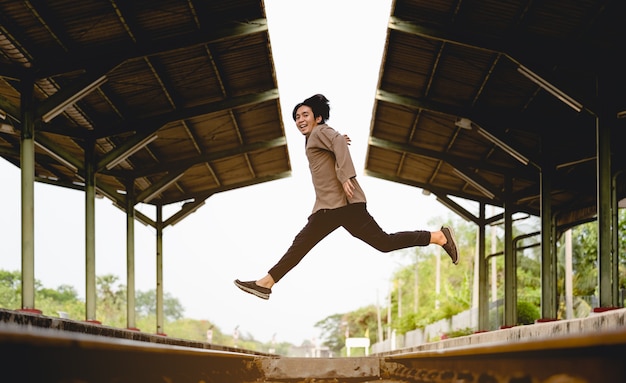 Man jumping on railway, Image for travel and lifestyle concept  