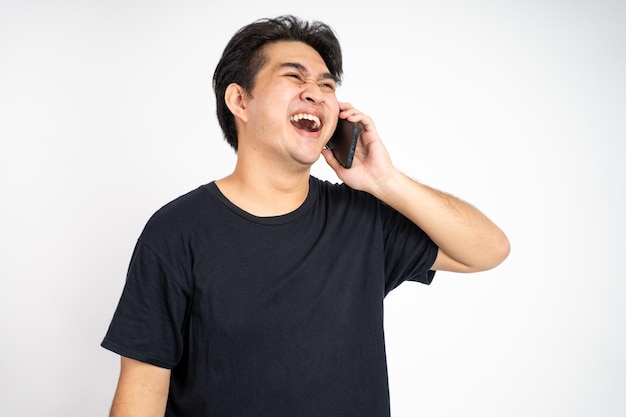 Man laughing while making phone call on isolated background