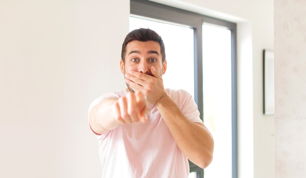 man laughing at you, pointing to front and making fun of or mocking you