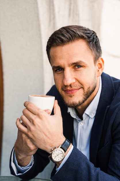 Man like coffee Handsome man with cup of coffee in cafe Morning lifestyle of man