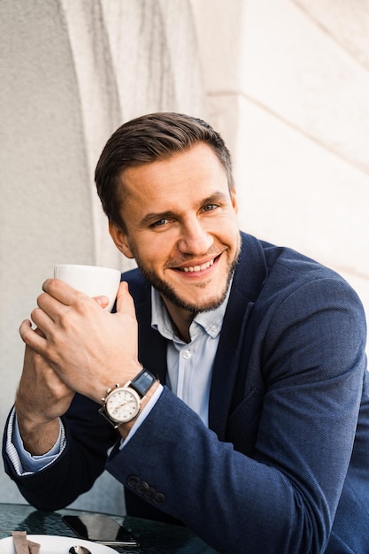 Man like coffee Handsome man with cup of coffee in cafe Morning lifestyle of man