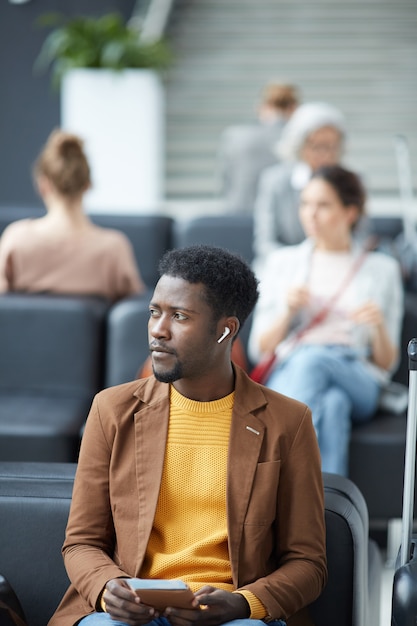 Man listening to audio in wireless earphones