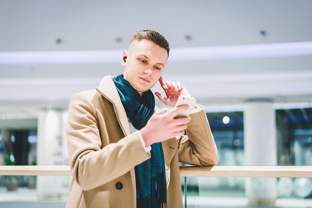 Man listening to music at the airport