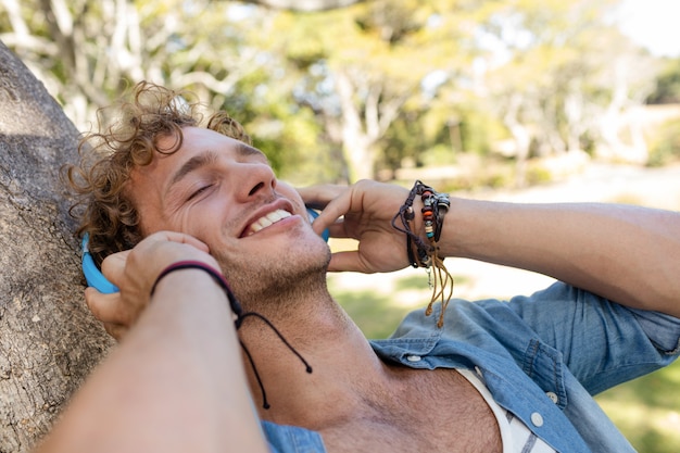 Man listening to music in park