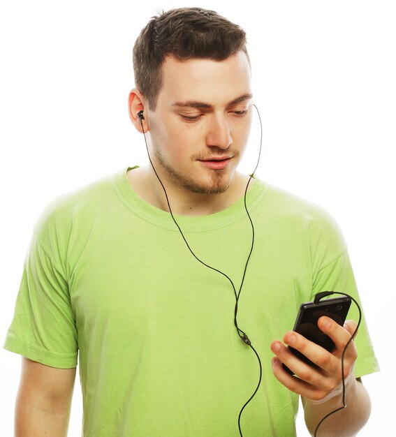 man listening music and using smartphone