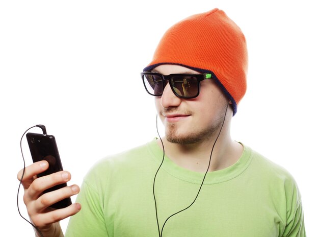 Photo man listening music and using smartphone