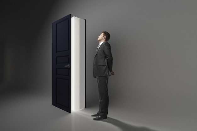 Man looking at book door