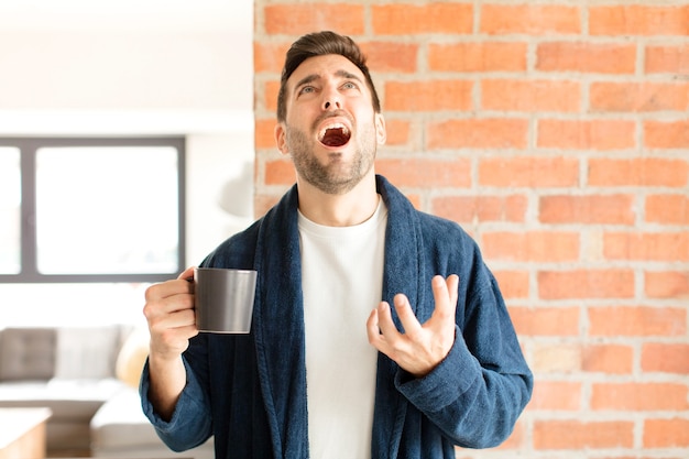 man looking desperate and frustrated, stressed, unhappy and annoyed, shouting and screaming