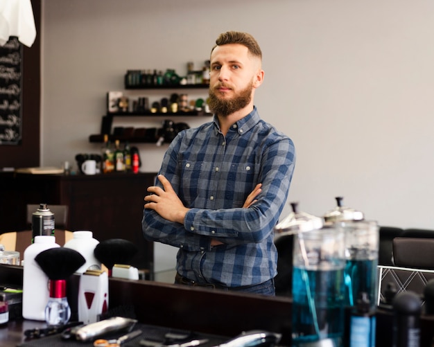 Man looking at himself in the mirror of a barber shop