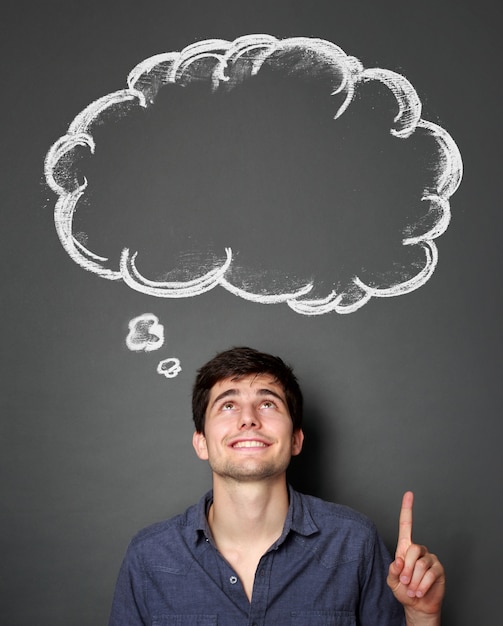 Man looking and pointing up to blank bubble speech