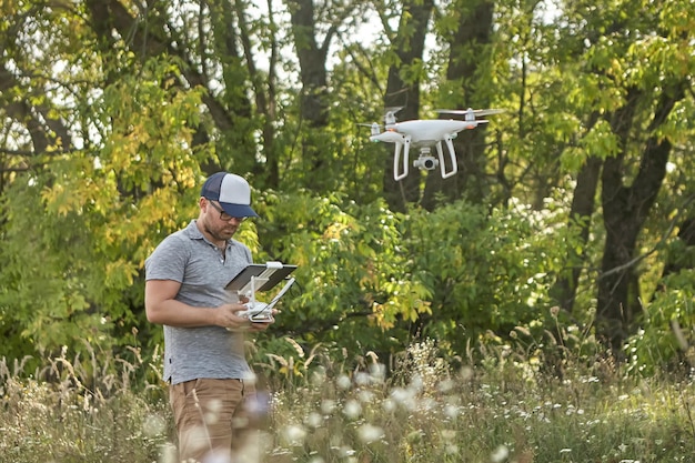 Man manages quadrocopters Remote control for the drone in the hands of men Unmanned aerial vehicle