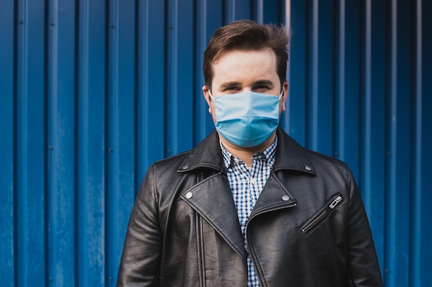 Man in mask against infectious diseases and flu.