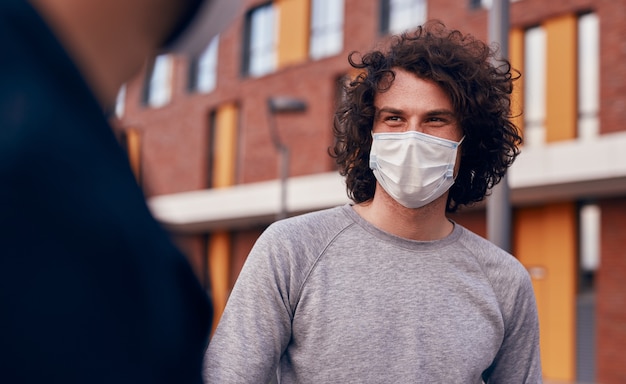 Man in mask communicating with friend