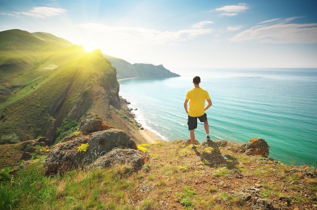 Man on mountain cliff