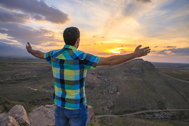 Man in mountain with sunset