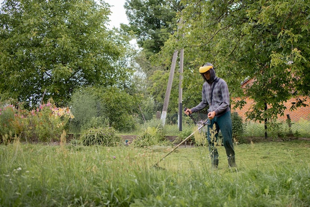 Man mowing the lawn in his garden