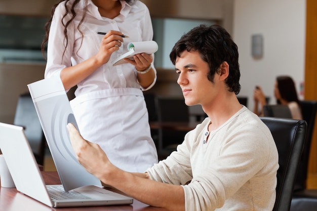 Man ordering food to a waitress