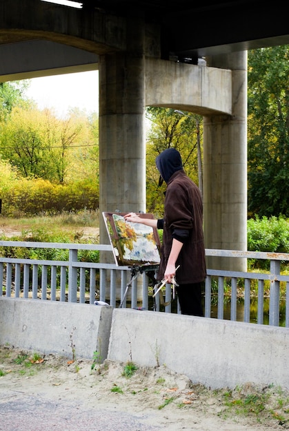 Man painting in nature