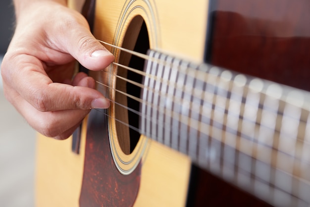 Man playing acoustic guitar