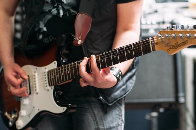 Man playing bass guitar studio