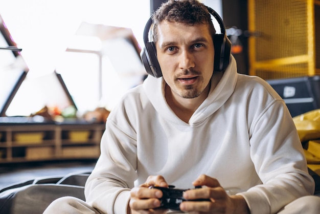 Man playing video game and wearing headphones