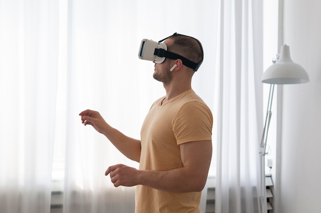 Man playing a videogame while wearing vr goggles