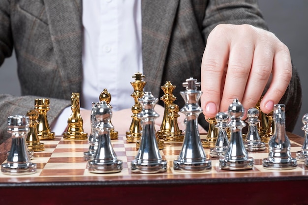 A man plays chess at the table