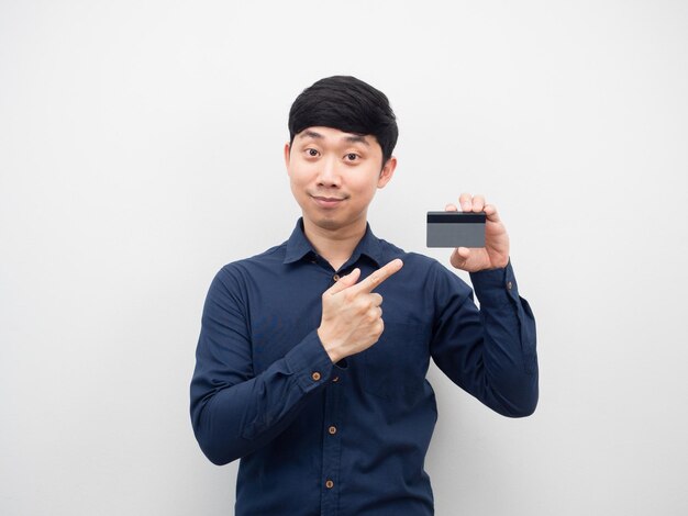 Man point finger at credit card in his hand