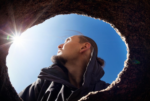 Man portrait from the cave window