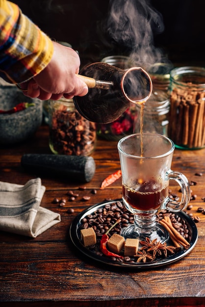 Man Pour Coffee in Mug