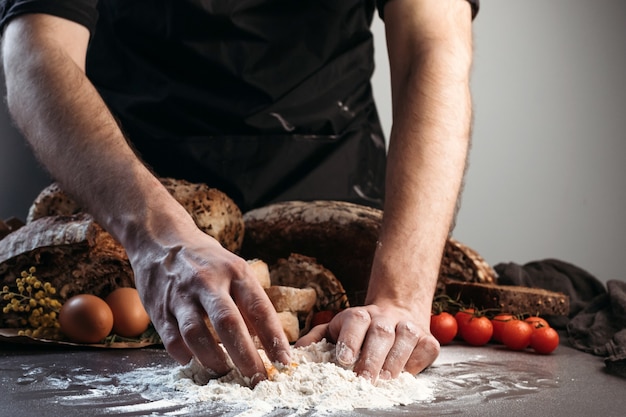 Man prepares dough for bread, gluten-free and without animal products. bread, gluten-free and without animal products.