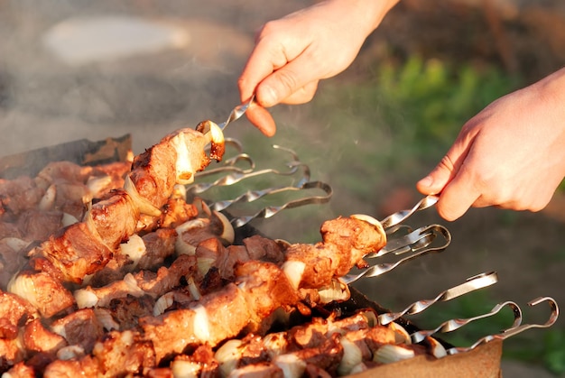 Man preparing barbecue in city cafe