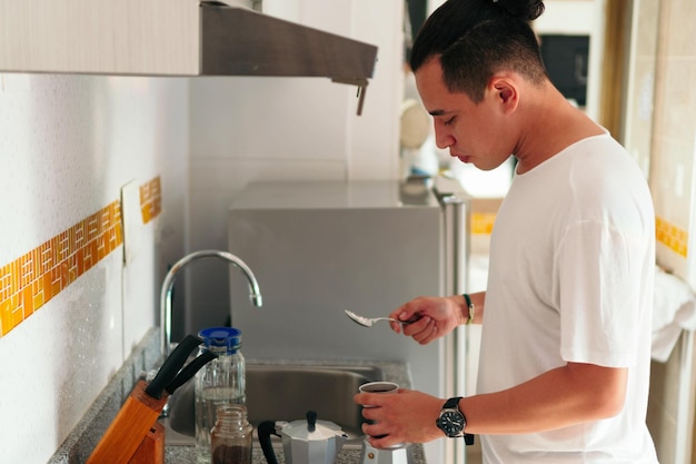 Man preparing a fresh espresso at home