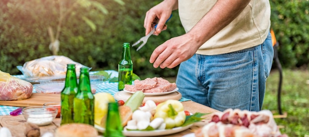 Man preparing meet for barbecue