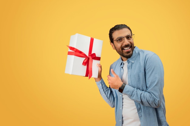 Man presenting gift with excitement