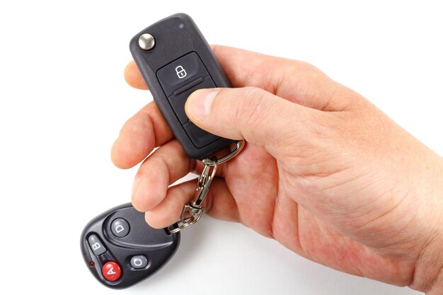 Man presses immobilizer button on ignition key