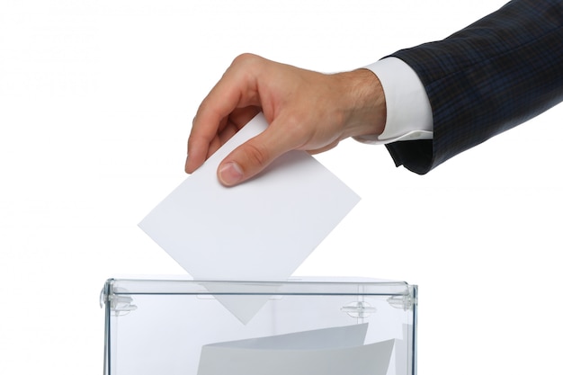 Man putting ballot into voting box isolated