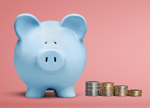 Man putting coin in pig moneybox