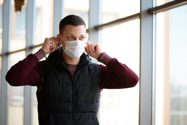 Man putting protective mask