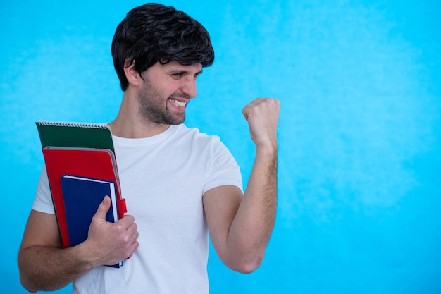 Man raising his hand with fist having good mood celebrating victory