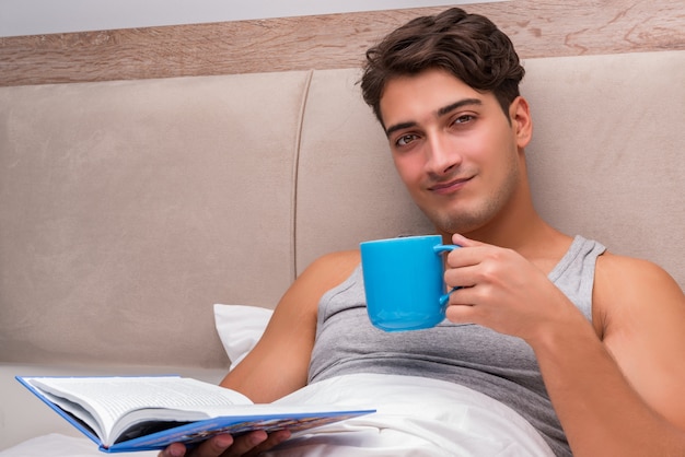 Man reading book in the bed