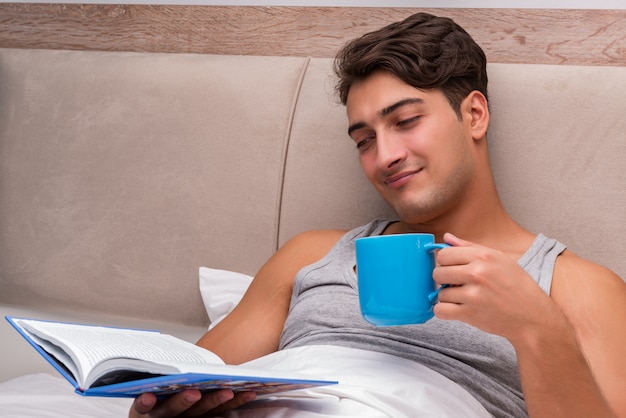 Man reading book in the bed