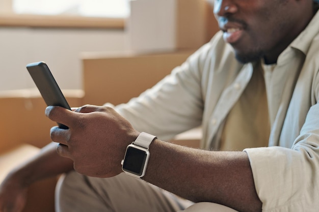 Man reading message on mobile phone