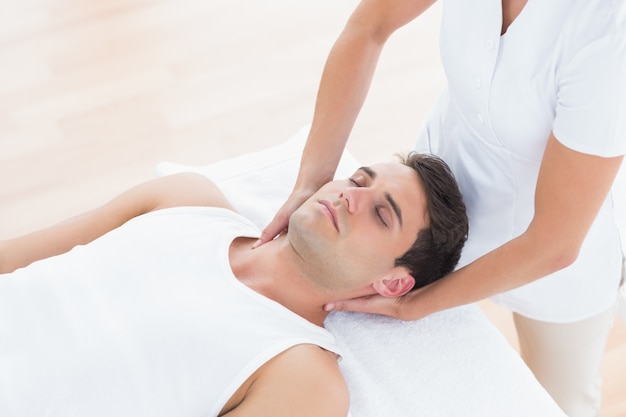 Man receiving neck massage 