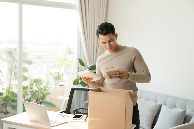 Man receiving parcel at home