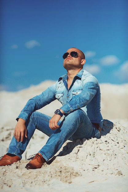 Man Relaxing On Beach