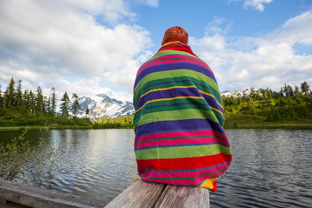 Man relaxing at beautiful  mountains lake.